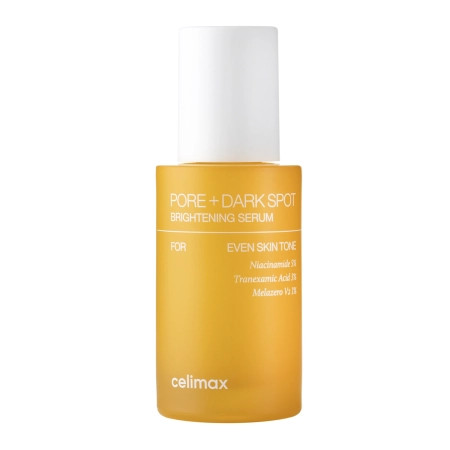 Frasco de suero facial dorado con etiqueta “PORE + DARK SPOT” y tapa blanca, sobre fondo claro.